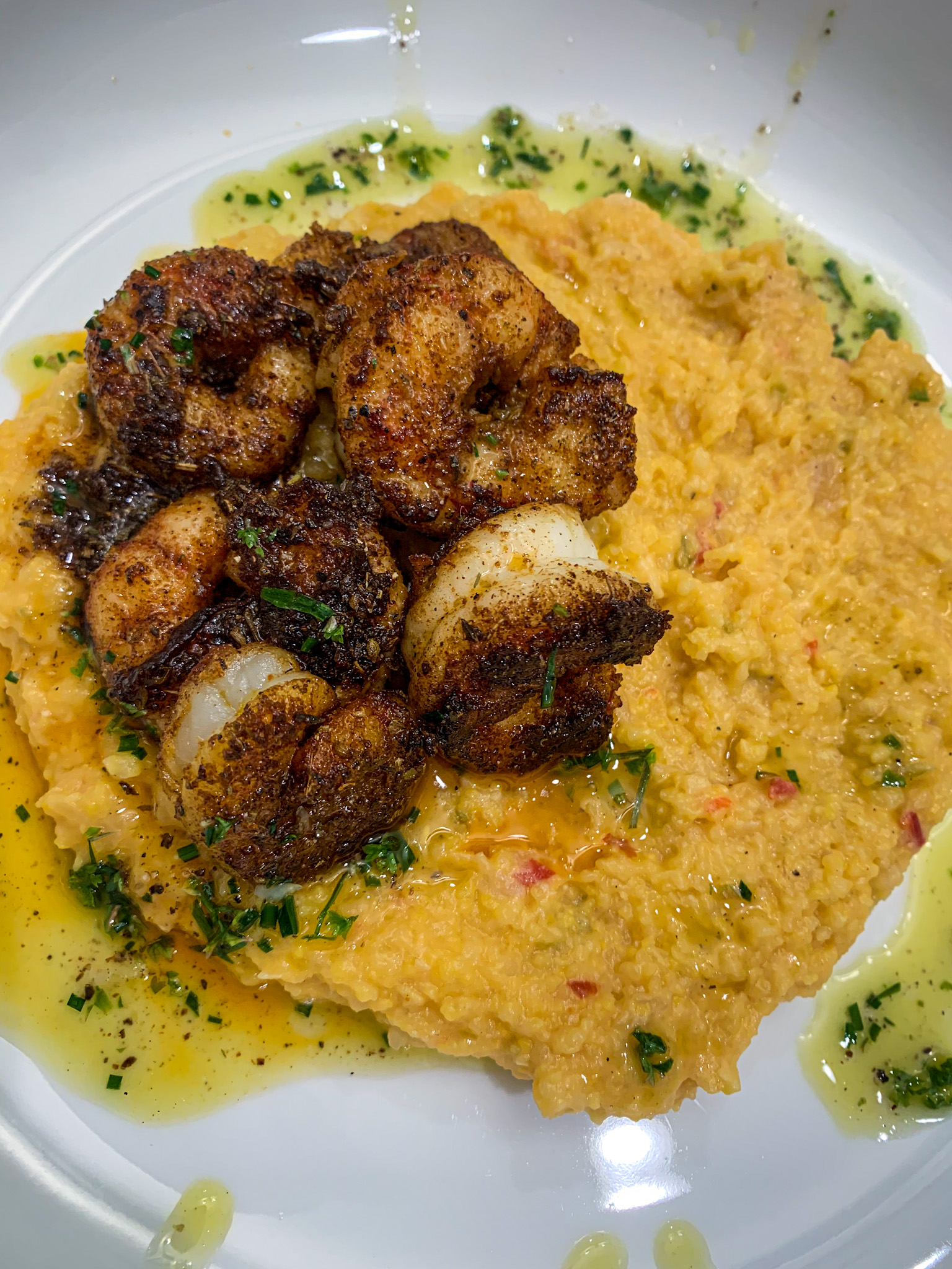 Blackened Shrimp with Pimento Cheese Polenta and Honey Lime Herb Oil